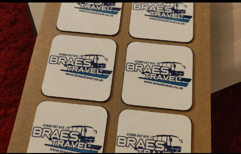 Boxed set of coasters printed with a travel company logo