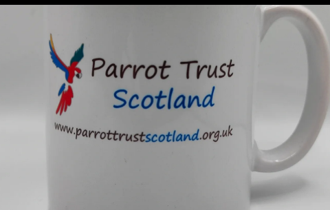 White mug printed with the Parrot Trust Scotland logo